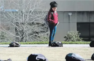  ??  ?? Signs and backpacks are scattered across the University of Tennessee at Chattanoog­a, as part of the Active Minds Send Silence Packing Tour meant to bring awareness to mental health issues. Some backpacks included belongings of victims and letters with...