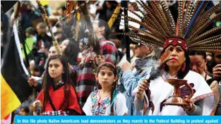  ?? — AFP ?? In this file photo Native Americans lead demonstrat­ors as they march to the Federal Building in protest against President Donald Trump’s executive order fast-tracking the Keystone XL and Dakota Access oil pipelines, in Los Angeles, California on February 5, 2017.