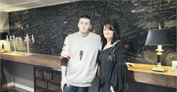  ?? PHOTOS: HEIDI ATTER ?? Marie Agioritis says when her son, Kelly, died of a fentanyl overdose in 2015, she decided to become an advocate and speak out about opioids. Agioritis and her other son, Kayle Best, who is a recovering addict, are shown above in front of a blackboard covered in messages to Kelly.