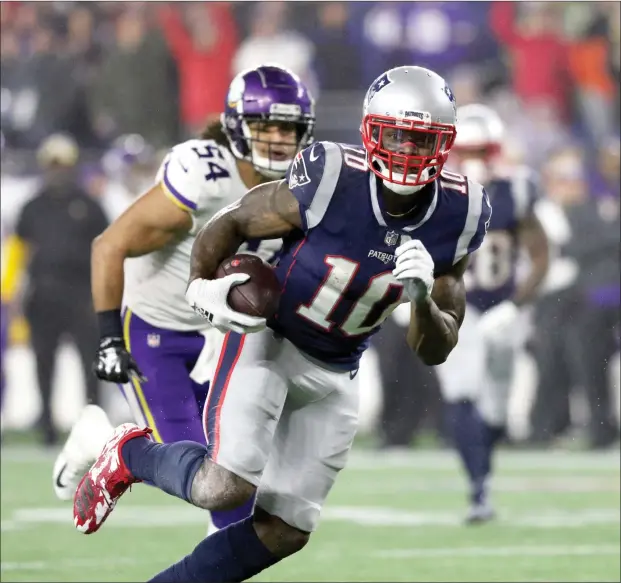  ?? Photo by Louriann Mardo-Zayat / lmzartwork­s.com ?? Patriots wide receiver Josh Gordon (10, above) runs away from Minnesota’s Eric Kendricks (54) for a 24-yard touchdown during New England’s 24-10 victory over the Vikings Sunday at Gillette Stadium.