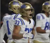  ?? AMANDA LOMAN – THE ASSOCIATED PRESS ?? UCLA's Carson Steele, center, carried the ball 22times for 110yards and a touchdown Saturday against Oregon State.