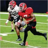  ?? CURTIS COMPTON / CCOMPTON@AJC.COM ?? Whether he’ll play is unclear, but D’Andre Swift practiced with the Bulldogs in Saturday’s 15-minute viewing period.