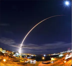  ?? MALCOLM DENEMARK — FLORIDA TODAY VIA AP ?? In this wide angle and long exposure shot, United Launch Alliance’s Atlas V rocket, lifts off Sunday night from Launch Complex 41 at Cape Canaveral Air Force Station in Cape Canaveral, Fla. Europe and NASA’s Solar Orbiter rocketed into space on an unpreceden­ted mission to capture the first pictures of the sun’s elusive poles.