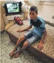  ??  ?? Montaser, at his Gaza home, is haunted by his brother’s killing