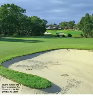  ??  ?? Several bunkers and a creek complicate the approach to the 9th green of the Lakes.