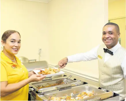  ??  ?? Jamaica Tourist Board’s Business Developmen­t Manager for North East USA, Victoria Harper, was delighted to be served by waiter Andre Miller.