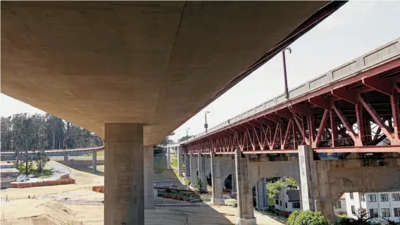  ?? Photos by Michael Macor / The Chronicle ?? The view beneath the new roadway with Doyle Drive to the right — Caltrans is preparing to replace Doyle Drive with a temporary detour.