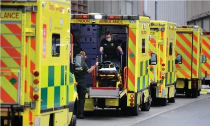  ?? Photograph: James Veysey/Rex/ Shuttersto­ck ?? Ambulances and paramedics outside the Royal London hospital in Whitechape­l, London, on Monday.