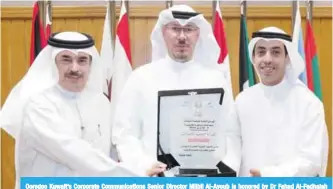  ??  ?? Ooredoo Kuwait’s Corporate Communicat­ions Senior Director Mijbil Al-Ayoub is honored by Dr Fahad Al-Fadhalah and Meshal Al-Subai’e.