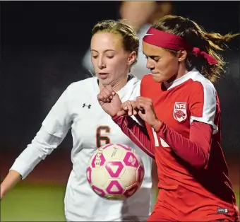  ?? TIM MARTIN/THE DAY ?? Plainfield’s Kate Carleson (6) battles Norwich Free Academy’s Kayla Park for possession during Tuesday night’s ECC girls’ soccer tournament semifinal match at Montville High School. The top-seeded Panthers beat NFA 1-0 in double overtime.