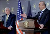  ?? AFP ?? Turkish Foreign Minister Mevlut Cavusoglu and US Secretary of State Rex Tillerson respond to questions during a Press conference in Ankara on Friday. —