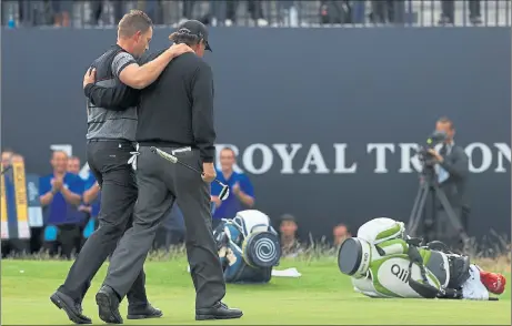  ?? Picture: Getty ?? BROTHERS IN ARMS: Henrik Stenson, left, and Phil Mickelson walk off the 18th green at Royal Troon.