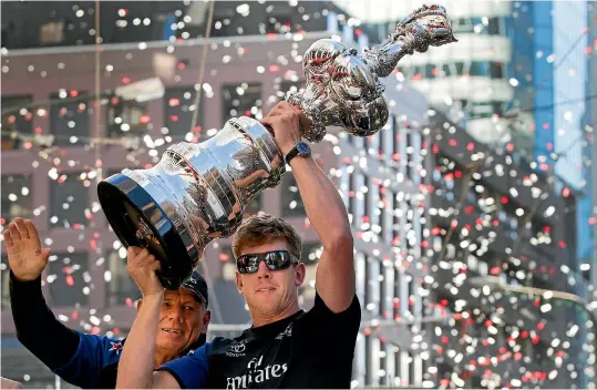  ?? PHOTO: STUFF ?? Thousands of people turned out to see the America’s Cup when Grant Dalton and Peter Burling paraded it through Wellington.