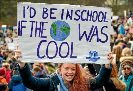  ?? GETTY IMAGES ?? Students take part in a protest as part of the Global Climate Strike campaign outside the Scottish Parliament in Edinburgh. Students around the world have taken to the streets to protest a lack of climate awareness and demand that elected officials take action on climate change.