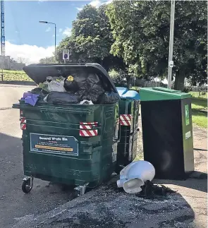  ??  ?? An overflowin­g bin in Menzieshil­l.