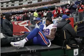  ?? Charles Krupa ?? The Associated Press Buffalo running back Travaris Cadet leaves after hurting his right ankle in the first half of Sunday’s loss to the Patriots.