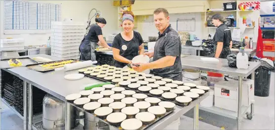  ?? Picture: RNZ/STUFF ?? Sheffield Pie Shop owners Loretta and Shane Paterson prepare some of the more than 3000 pies the shop has pumped out since reopening after the Christmas break on Wednesday. The business is on the market for the first time in twenty years.