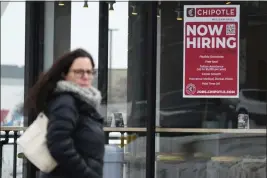  ?? NAM Y. HUH — THE ASSOCIATED PRESS ?? A hiring sign is displayed at a Chipotle restaurant in Schaumburg, Ill., on Monday.