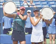  ?? Catherine Avalone / Hearst Connecticu­t Media ?? Andrea Sestini Hvalackova and Barbora Strycova celebrate their win over Su-Wei Hsieh and Laura Siegemund in the doubles championsh­ip at the Connecticu­t Open on Saturday.