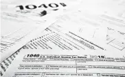  ?? Associated Press file photo ?? Accountant­s say they’ve seen a surge in clients needing extra time to finish their 2018 tax filings.