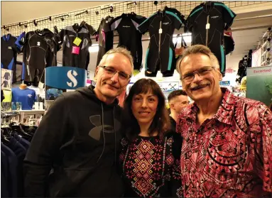  ?? BOB KEELER — MEDIANEWS GROUP ?? From left, husband and wife Thomas and Tetiana Rottler and David Valaika stand in Indian Valley Scuba, which is hosting a collection for donations for the people of Ukraine. Thomas Rottler is an instructor at Indian Valley Scuba. Tetiana Rottler is a native Ukrainian.