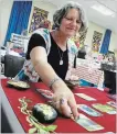  ?? JOHN LAW NIAGARA FALLS REVIEW ?? Tarot card reader Lynn Brazeau of Fonthill took part in the first annual Niagara Region Paganfest.