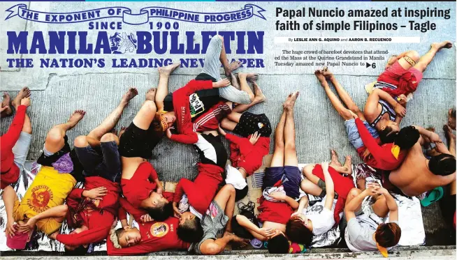  ??  ?? PROCESSION BREAK – Devotees rest on the roadside after joining the procession of the Black Nazarene Tuesday. A former jail guard who died after a heart attack is the lone fatality in Tuesday’s Traslacion. (EPA-EFE/Mark R. Cristino)