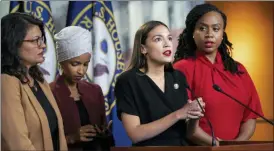  ?? J. SCOTT APPLEWHITE — THE ASSOCIATED PRESS FILE ?? Rep. Rashida Tlaib, D-Mich., Rep. Ilhan Omar, D-Minn., Rep. Alexandria Ocasio-Cortez, D-N.Y., and Rep. Ayanna Pressley, D-Mass., speak at the Capitol in Washington. All are American citizens and three of the four were born in the U.S. President Donald Trump told American congresswo­men of color to “go back” to where they came from. He later vowed to revive a racial slur to tear down Elizabeth Warren, promoted a wild conspiracy theory linking a past political opponent to the death of a high-profile sex offender and blamed Friday’s stock market slide on a low-polling former presidenti­al candidate.