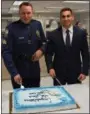  ?? PHOTO COURTESY OF UPPER GWYNEDD POLICE DEPARTMENT ?? Newly promoted Upper Gwynedd police Sergeant Chad Staub, left, and newly sworn in Officer Evan Meoli pose during a police department celebratio­n after the two were sworn in on Monday night.