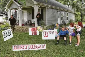  ?? Photos by Jon Shapley / Staff photograph­er ?? Bo Singleterr­y, front right, celebrates his 8th birthday with cousins Brooke Crawford, 6, and LeAnna Crawford, 7, on Friday at his home in Anahuac.