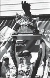  ?? ASSOCIATED PRESS ?? MATT KENSETH CELEBRATES in Victory Lane with the trophy after winning the NASCAR Pocono 400 in Long Pond, Pa., on Sunday.