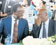  ?? Pictures: THULI DLAMINI ?? INSIDER TRADING: Sizwe Nxasana and Mike Mabuyakhul­u have a laugh at the opening of Acacia House