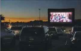  ??  ?? Agape Dance Academy’s Nutcracker is projected as a drive-in movie in December at the Santa Cruz Beach Boardwalk’s River parking lot. Agape made a pandemic pivot for its annual staging of the ballet to have the company’s 60 dancers filmed dancing in locations throughout Santa Cruz while wearing masks for staying socially distant for a Nutcracker movie.