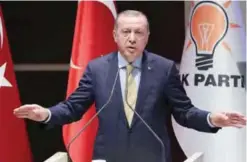  ??  ?? ANKARA: Turkish President Recep Tayyip Erdogan delivers a speech during a meeting of ruling Justice and Developmen­t (AK) Party provincial heads at the AK Party Headquarte­rs in Ankara. — AFP