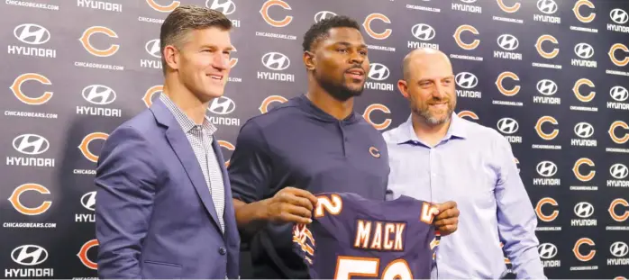  ?? TIM BOYLE/FOR THE SUN-TIMES ?? The last few seasons weren’t good for Ryan Pace’s reputation, but the Bears’ GM (left, with linebacker Khalil Mack and new coach Matt Nagy) now is seeing some of his earlier moves paying off.