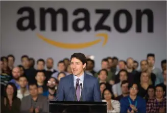  ?? The Canadian Press ?? Prime Minister Justin Trudeau makes an announceme­nt Monday at the future offices of Amazon in downtown Vancouver.