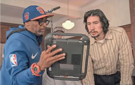  ??  ?? Spike Lee (left) confers with actor Adam Driver on the set of Lee’s film “BlacKkKlan­sman.”