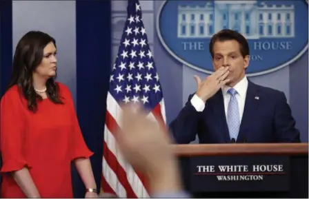  ?? PABLO MARTINEZ MONSIVAIS — THE ASSOCIATED PRESS ?? Sarah Huckabee Sanders, left, who has been named White House press secretary, watches as incoming White House communicat­ions director Anthony Scaramucci, right, blowing a kiss after answering questions during the press briefing in the Brady Press...