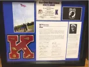  ?? Photo by Todd Stanko ?? Displayed items include the framed Kane Area High School Athletic Award, a photo of the memorial Flagpole, a heartfelt letter from the school district expressing gratitude, a poignant write-up in memory of Lieutenant Commander Gary Anderson, and a powerful POW MIA "You are not forgotten" image, capturing the essence of honor, sacrifice, and remembranc­e.