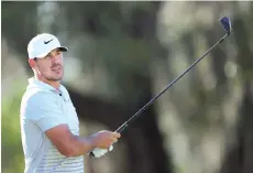  ?? - AFP photo ?? Brooks Koepka of the United States plays his shot from the 15th tee during the second round of World Golf Championsh­ips-Workday Championsh­ip at The Concession in Bradenton, Florida.