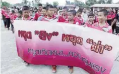  ??  ?? NARATHIWAT: Children hold a banner that reads, stop the killing, stop the shooting during a march for peace in Thailand’s restive southern province of Narathiwat yesterday. —AFP