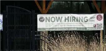  ?? Daily camera ?? A PLUNGE: A ‘now hiring’ is seen outside a pool in Boulder, Colo., on Monday.