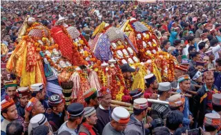  ?? — PTI ?? Devotees carry deities from different villages to participat­e in Dussehra festival on the eve of the Internatio­nal Kullu Dussehra at Dhalpur Ground in Kullu on Saturday.