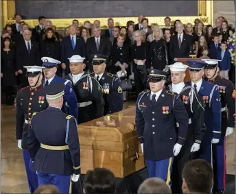  ?? AP PHOTO ?? The body of Rev. Billy Graham is carried into the Capitol Rotunda in Washington on Wednesday.