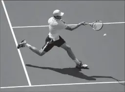  ?? Associated Press ?? Sam Querrey returns a shot to Janko Tipsarevic during the first round of the U.S. Open tennis tournament on Tuesday in New York.