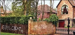  ??  ?? Writing on the wall: Abusive messages on the wall outside the Giggs mansion