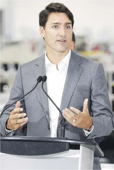  ?? JOHN WOODS / THE CANADIAN PRESS ?? Prime Minister Justin Trudeau, seen at a new Canada Goose factory in Winnipeg, said Tuesday he “won’t be weighing in” on Doug Ford’s efforts to downsize Toronto council.