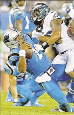  ?? AP ?? Eagles keep the pressure on Carolina’s Cam Newton as Philly improves to 5-1 with win over Panthers on Thursday.