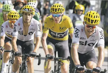  ?? PETER DEJONG – THE ASSOCIATED PRESS ?? Britain’s Chris Froome, second from right, holds a 23-second overall lead as he seeks his fourth Tour de France title.