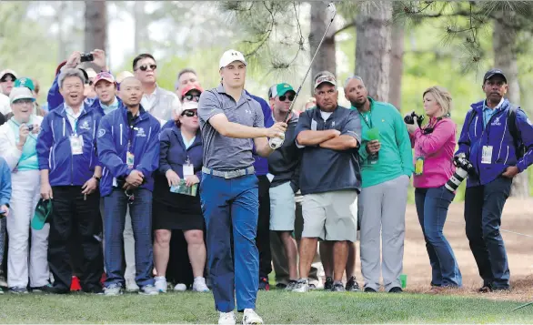  ?? DAVID
J. PHILLIP/AP PHOTO ?? Jordan Spieth watches his shot from the rough on the 10th hole Wednesday during a practice round for the Masters, which starts Thursday in Augusta, Ga.